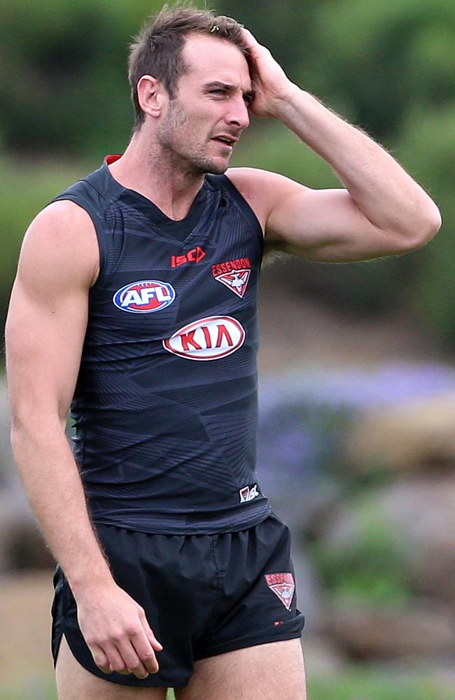 The shadow of deposed Brownlow Medallist Jobe Watson loomed over Sam Mitchell and Trent Cotchin as they accepted the 2012 gong. Picture: Hamish Blair