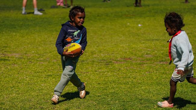 Melbourne Demons players Shane McAdam and Andy Moniz-Wakefield went to Santa Teresa ahead of the 2025 AFL game in Alice Springs. Picture: Melbourne Demons