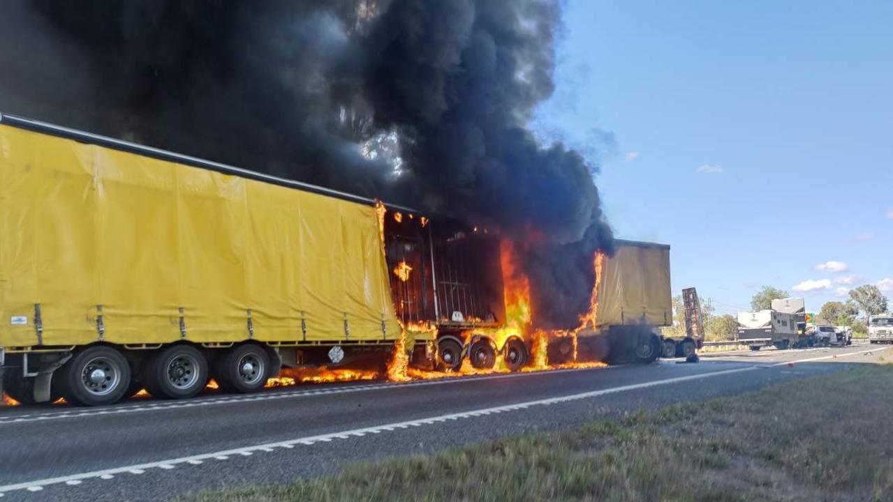 A truck on fire at the crash scene on the Bruce Highway, south of Rockhampton, on July 19, 2023.