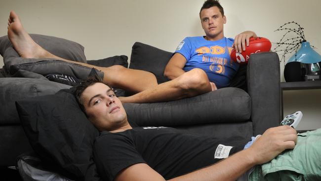 McIntosh and Grima pictured at home in 2011 recovering from injuries.