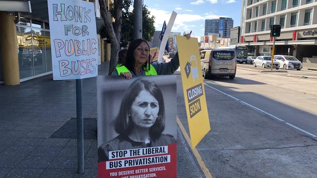 Anti-public bus privatisation demonstrators sought public support outside NSW Liberal MP for Wakehurst, Brad Hazzard's electorate office at Dee Why. Picture: Jim O'Rourke