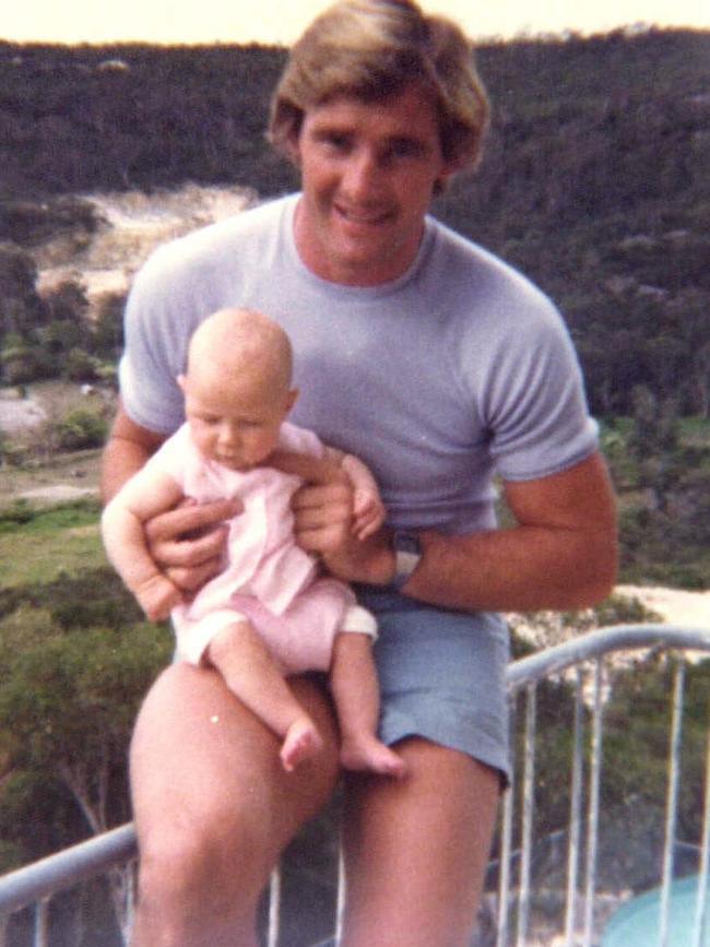 Chris Dawson with one of his children.