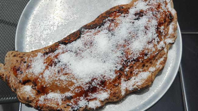 The ‘Chocobueno’ calzone made with chocolate dough and filled with Nutella and white chocolate and topped with grated coconut ($24).