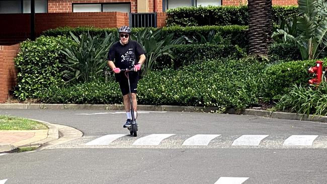 Chris Griffith tests an e-scooter.