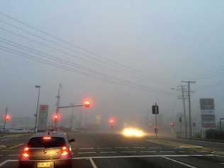 LIGHTS ON: Fog blankets the Bruce Highway in Gympie early Monday morning. Picture: Frances Klein