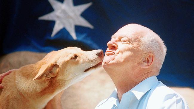 Blacktown Mayor Alan Pendleton with a dingo at Featherdale Wildlife Park on January 17, 2003. Picture: Ann Moran