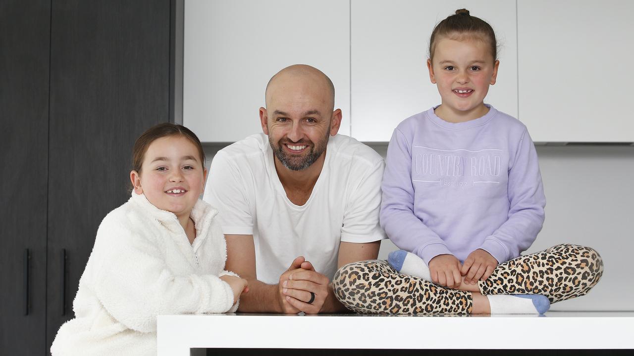 Stories with a message … Nathan Lyon (pictured with daughters Harper and Milla) has penned two books for kids, taking on bullying and self-belief as key themes. Picture: John Appleyard