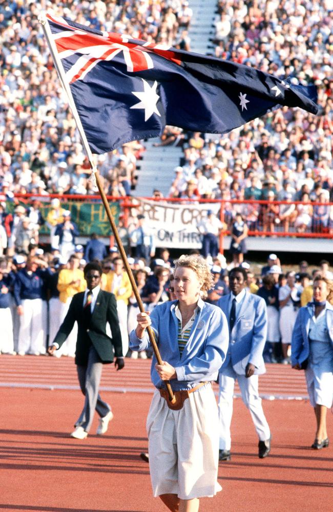 Proud duty … Lisa Curry carrying the Australian flag at the 1982 Commonwealth Games.