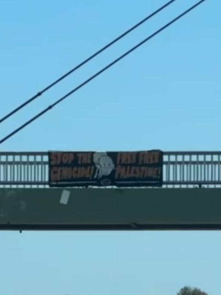 A sign hung over the footbridge near Oxenford. Picture: Supplied.