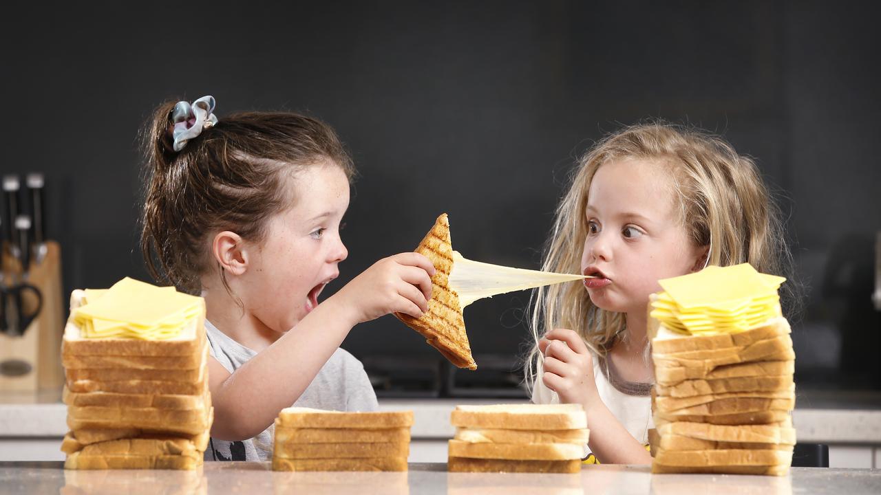 Five year olds Charlotte and Matisse love a good cheese toastie no matter what it’s called. Picture: David Caird