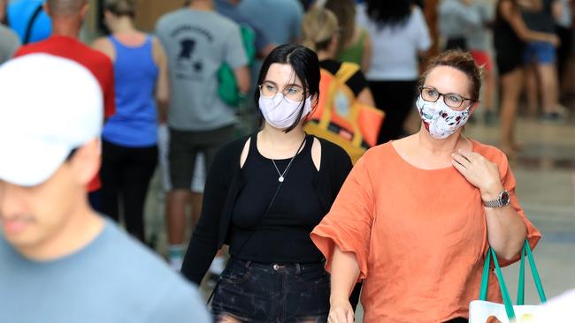 Hundreds of people line up to get into Woolworths at Gasworks Plaza in Newstead after it was announced Greater Brisbane would go into lockdown for 3 days from 6pm. Pics Adam Head