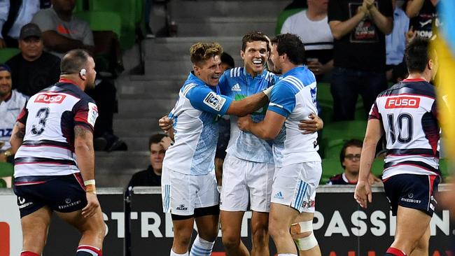 Matt Duffie of the Blues (centre) celebrates after scoring a try during the round 1 Super Rugby match between the Melbourne Rebels and the Blues at AAMI Park in Melbourne, Thursday, Feb. 23, 2017. (AAP Image/Tracey Nearmy) NO ARCHIVING, EDITORIAL USE ONLY