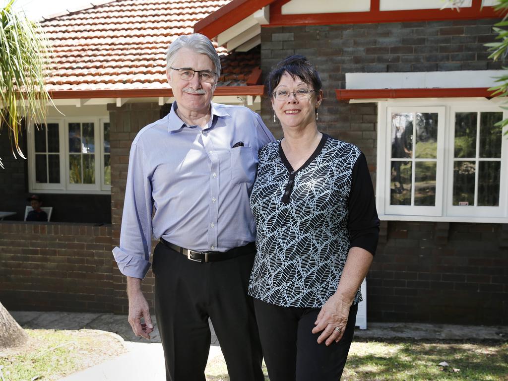 Vendors Brad and Christine Kerr put on a brave face after 17 Beresford Ave, Chatswood, passes in on a vendor bid of $1.7 million. Picture: Richard Dobson