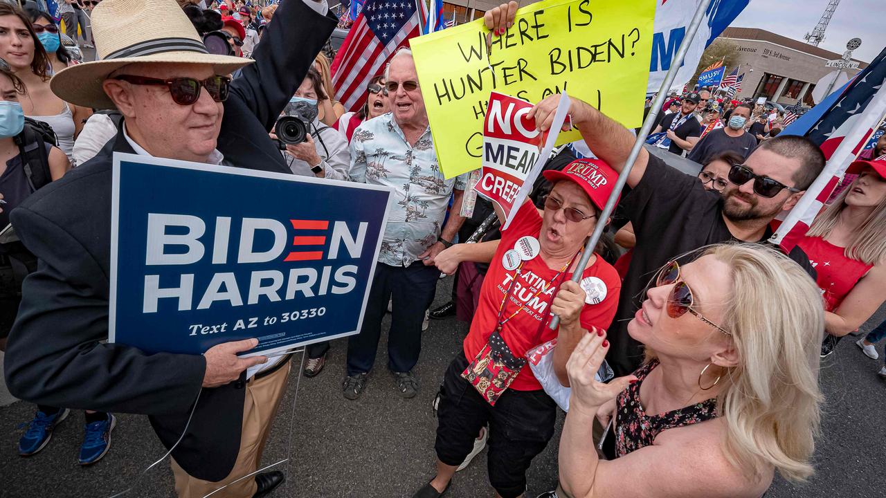 A Biden supporter protests in a crowd of Trump supporters in Phoenix, Arizona. Picture: Olivier Touron/AFP