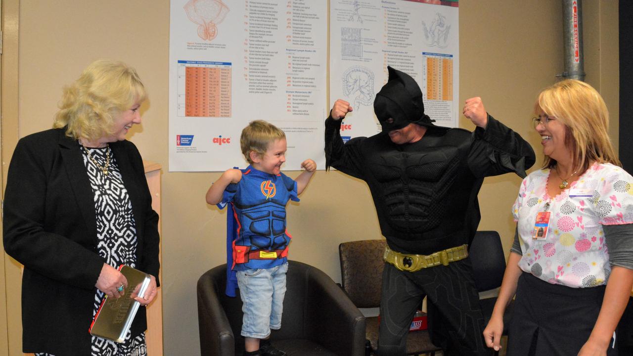 Toowoomba City Rotary Club community services director, Maree Schwerin, Parker Williams, Batman (aka Paul Wilson) and clinical oncology nurse at Toowoomba Base Hospital, Lori Benitez.