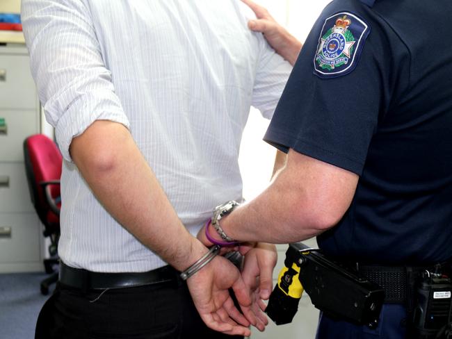 A man being handcuffed by police. Generic queensland police. Photo Amy Lyne / Gatton Star