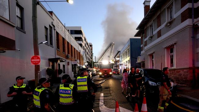 Multiple fire units spray water on buildings on fire in Hubert St, Gabba - on Wednesday 25th of September - Photo Steve Pohlner