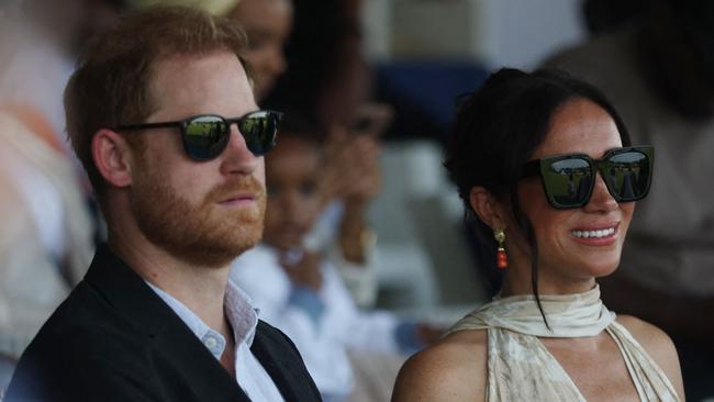 Britain's Prince Harry (L), Duke of Sussex, and Britain's Meghan (R), Duchess of Sussex, attend a charity polo game at the Ikoyi Polo Club in Lagos on May 12, 2024 as they visit Nigeria as part of celebrations of Invictus Games anniversary. (Photo by Kola Sulaimon / AFP)