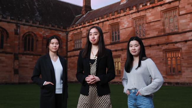 Angela Choi, 20, Anastasia Cao, 21, and Jasmine Goh, 19, at Sydney University on Wednesday. Ms Cao says looking for a graduate role in the middle of a pandemic is ‘confronting’ and ‘scary’. Picture: John Feder