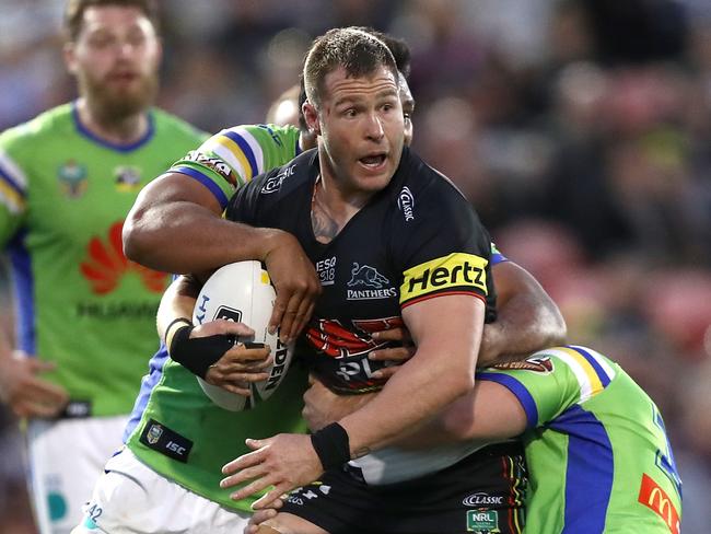 PENRITH, AUSTRALIA - AUGUST 05: Trent Merrin of the Panthers is tackled during the round 21 NRL match between the Penrith Panthers and the Canberra Raiders at Panthers Stadium on August 5, 2018 in Penrith, Australia.  (Photo by Ryan Pierse/Getty Images)