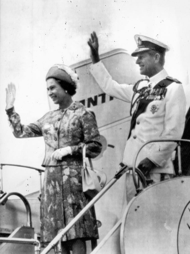 Royal visit and tour of Australia by Queen Elizabeth II and the Duke of Edinburgh. The Queen and Prince Philip wave from aircraft at airport in Canberra, 07 Mar 1977.