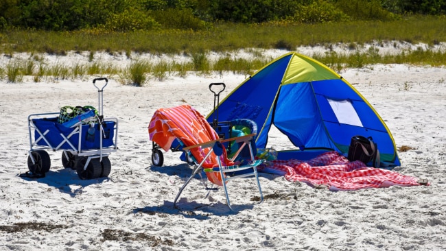 Gone are the days where you just headed to the beach with a towel and sunscreen. Image: iStock 