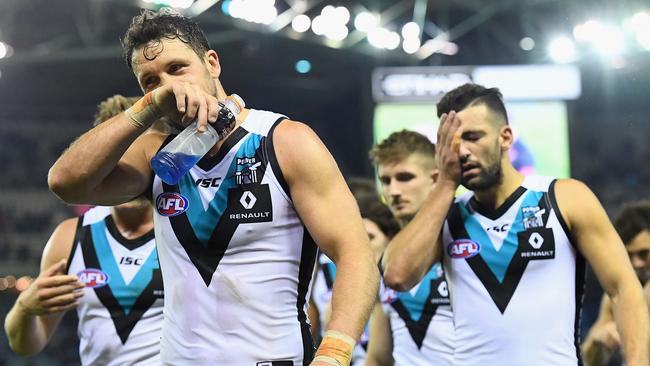 Port captain Travis Boak leads the Power off the field after their drubbing from Essendon last year. Picture: Quinn Rooney/Getty Images)