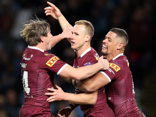 SYDNEY, AUSTRALIA - JUNE 08: Daly Cherry-Evans of the Maroons  celebrates with teammates after scoring a try during game one of the 2022 State of Origin series between the New South Wales Blues and the Queensland Maroons at Accor Stadium on June 08, 2022 in Sydney, Australia. (Photo by Cameron Spencer/Getty Images)