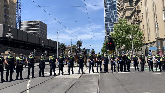 Officers formed a ring around the group. Picture: Brianna Travers