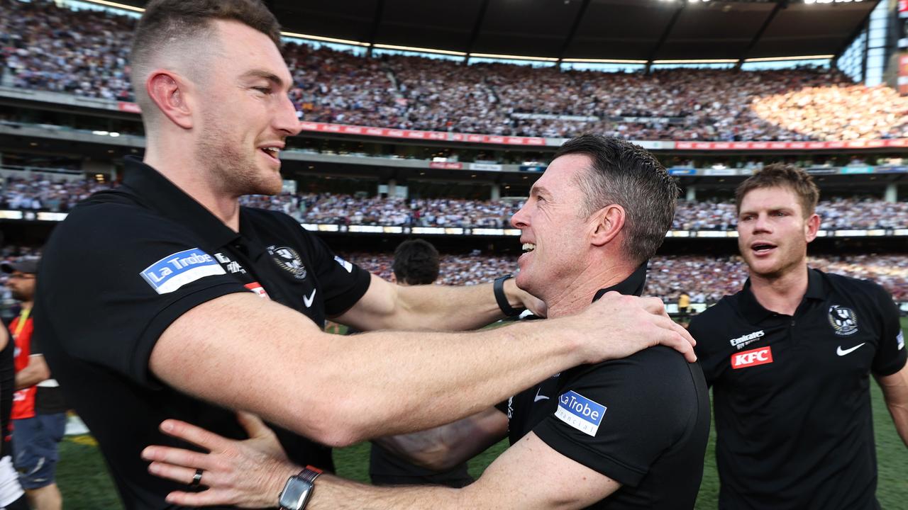 Dan McStay celebrates with Magpies coach Craig McRae after the grand final. Picture: Michael Klein
