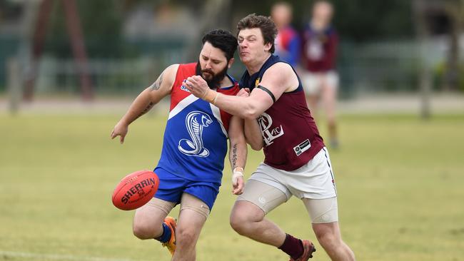 Logan fires a kick away. Picture: AAP/Chris Eastman