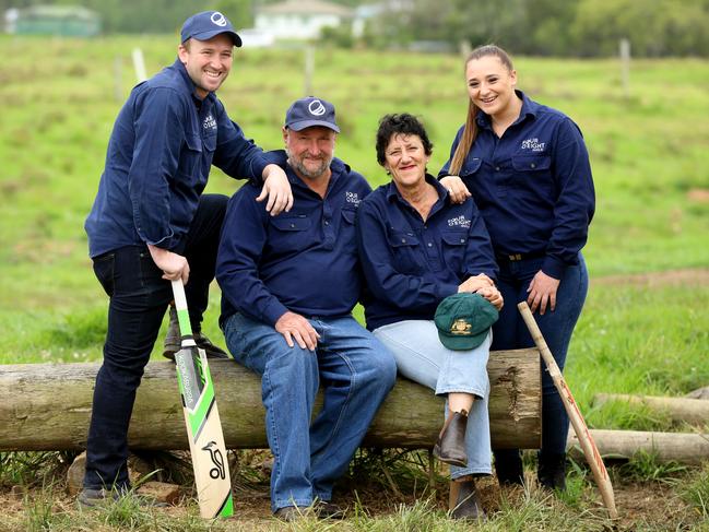 Phillip Hughes’ family on the family farm at Macksville (from left)Jason, Greg, Virginia and Megan with Phillip's cricket bats and Baggy Green. Picture: Nathan Edwards