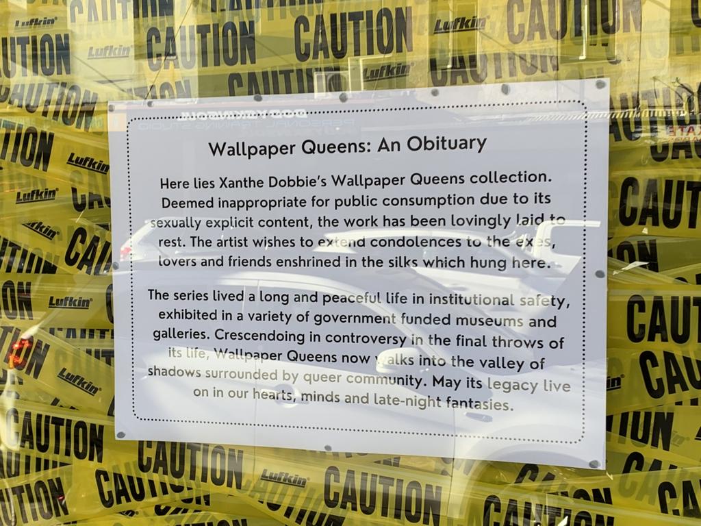 The window is now covered with tape saying CAUTION and a notice with the headline “Wallpaper Queens: An Obituary”. Picture: Ben Pike