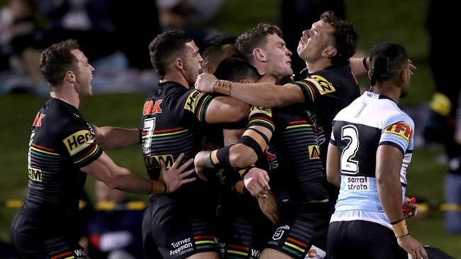 Liam Martin celebrates with his Panthers teammates after scoring a try against Cronulla. Picture: Mark Kolbe/Getty Images