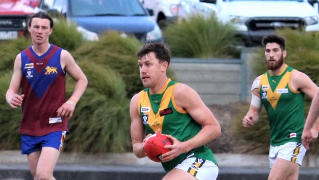 Leongatha's Aaron Heppell charges away from his Moe opponent on Saturday. Picture: Daniel Heathcote