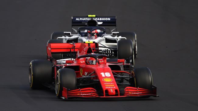 NUERBURG, GERMANY - OCTOBER 11: Charles Leclerc of Monaco driving the (16) Scuderia Ferrari SF1000 leads Pierre Gasly of France driving the (10) Scuderia AlphaTauri AT01 Honda during the F1 Eifel Grand Prix at Nuerburgring on October 11, 2020 in Nuerburg, Germany. (Photo by Bryn Lennon/Getty Images)