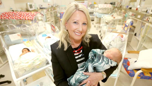 Pictured at the Pindara Private Hospital CEO Trish Hogan cuddling baby Sylvie Smith in the maternity ward. Picture Mike Batterham