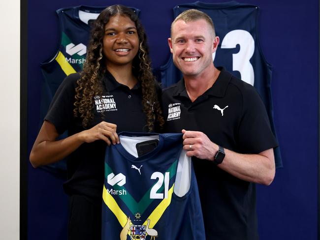 Danika McDonald of the AFL National Academy is presented her jumper by AFL National Academy Manager and Head Coach Tarkyn Lockyer. Picture: Josh Chadwick/AFL Photos