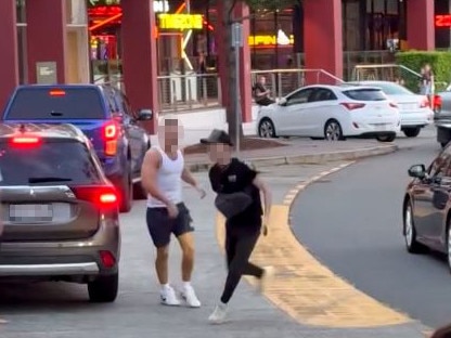 The youth runs from the car after being hauled out. Picture: Miami Residents Group / Facebook.