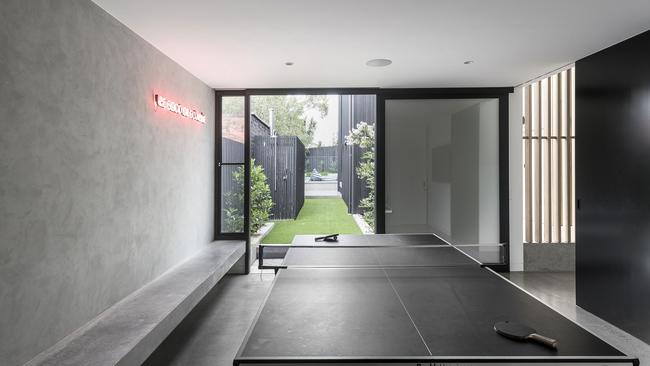 An ultra-cool games room leads directly to the pool.