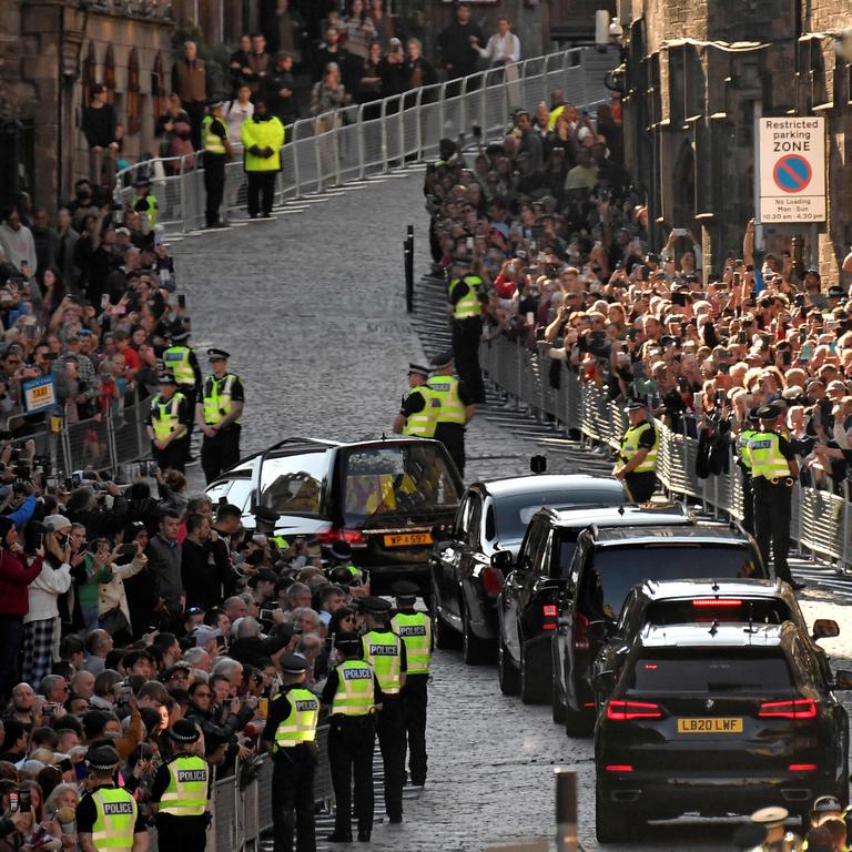 The hearse carrying the coffin of Queen Elizabeth II leaves from from St Giles' Cathedral in Edinburgh. (Photo by LOUISA GOULIAMAKI / POOL / AFP)