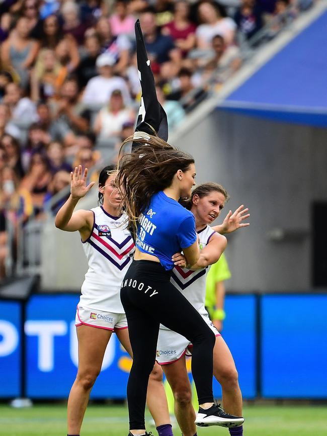 Kiara Bowers stopping the pitch invader at Optus Stadium.