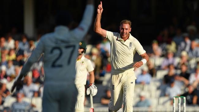 England's Stuart Broad celebrates taking the vital wicket of Pat Cummins.