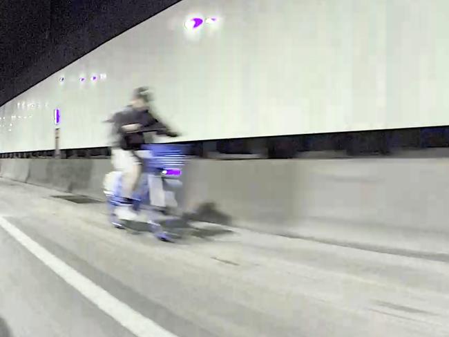 DAILY TELEGRAPH NOVEMBER 28, 2024. Dash cam footage shows an Ebike rider with no helmet heading southbound in the M8 tunnel at Arncliffe. Picture: Jonathan Ng