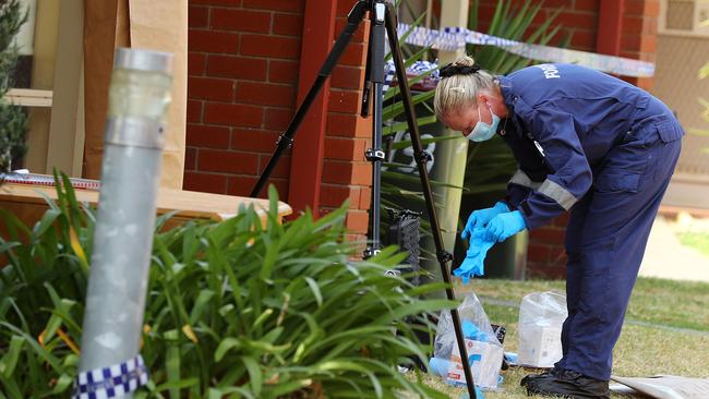 Police forensics at the scene of a Godfrey St assault. Picture: Alison Wynd