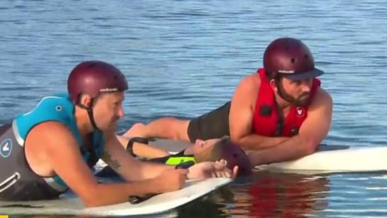 The journalist was pulled from the water after ‘falling awkwardly’ during the segment. Picture: Channel 9.