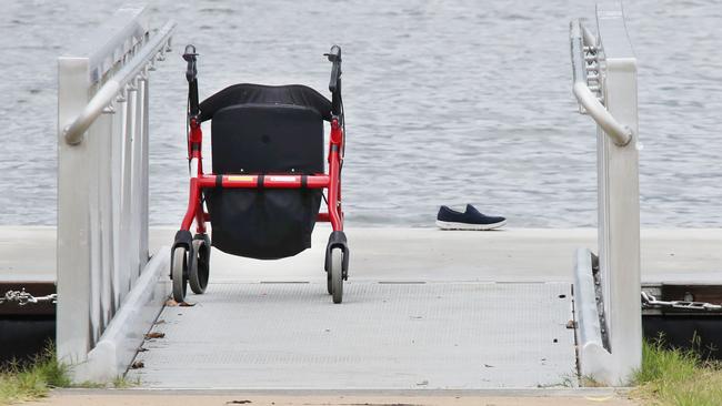 A walking frame and a shoe on an empty pontoon told the grim story when a body was found on the rocks at Emerald Lakes on the Gold Coast. Picture Glenn Hampson