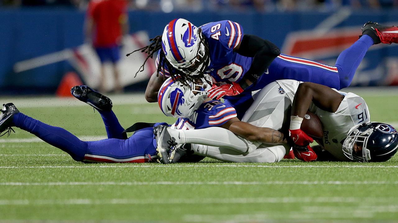 ORCHARD PARK, NEW YORK - SEPTEMBER 19: Tremaine Edmunds #49 of the Buffalo Bills collides with teammate Dane Jackson #30 after a play against Treylon Burks #16 of the Tennessee Titans during the second quarter of the game at Highmark Stadium on September 19, 2022 in Orchard Park, New York. (Photo by Joshua Bessex/Getty Images) *** BESTPIX ***