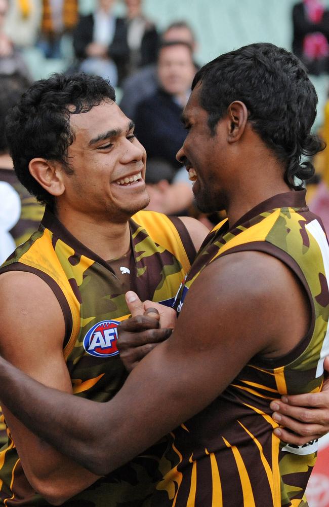 Cyril Rioli and Carl Peterson during their time at Hawthorn.