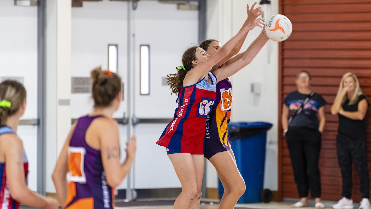 Emilie Bizzell (left) of Darling Downs against Talia Marshall of Sunshine Coast in Queensland School Sport 13-15 Years Girls Netball championships at The clive Berghofer Sports centre, The Glennie School, Friday, May 6, 2022. Picture: Kevin Farmer